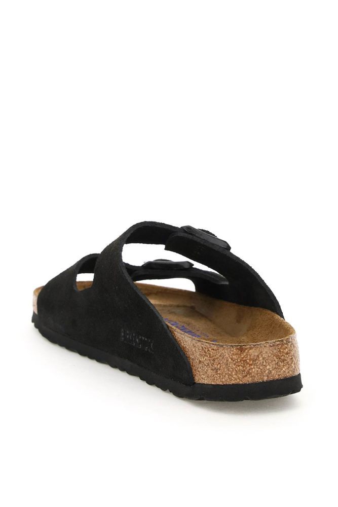 Arizona sandal by BIRKENSTOCK made of suede leather with double adjustable strap with painted metal buckle tone on tone with debossed logo. Suede leather footbed, moulded cork and latex sole and EVA tread. Soft footbed and narrow fit.