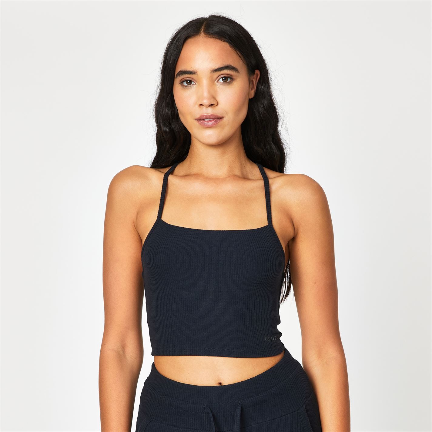 Take comfort to the next level with the USA Pro ribbed crop top, featuring a fashionably flattering square neckline. The soft-touch fabric and ribbed design will keep you feeling cosy while a unique strap detail features a stylish twist. Pair with the USA Pro ribbed joggers for a complete loungewear set.