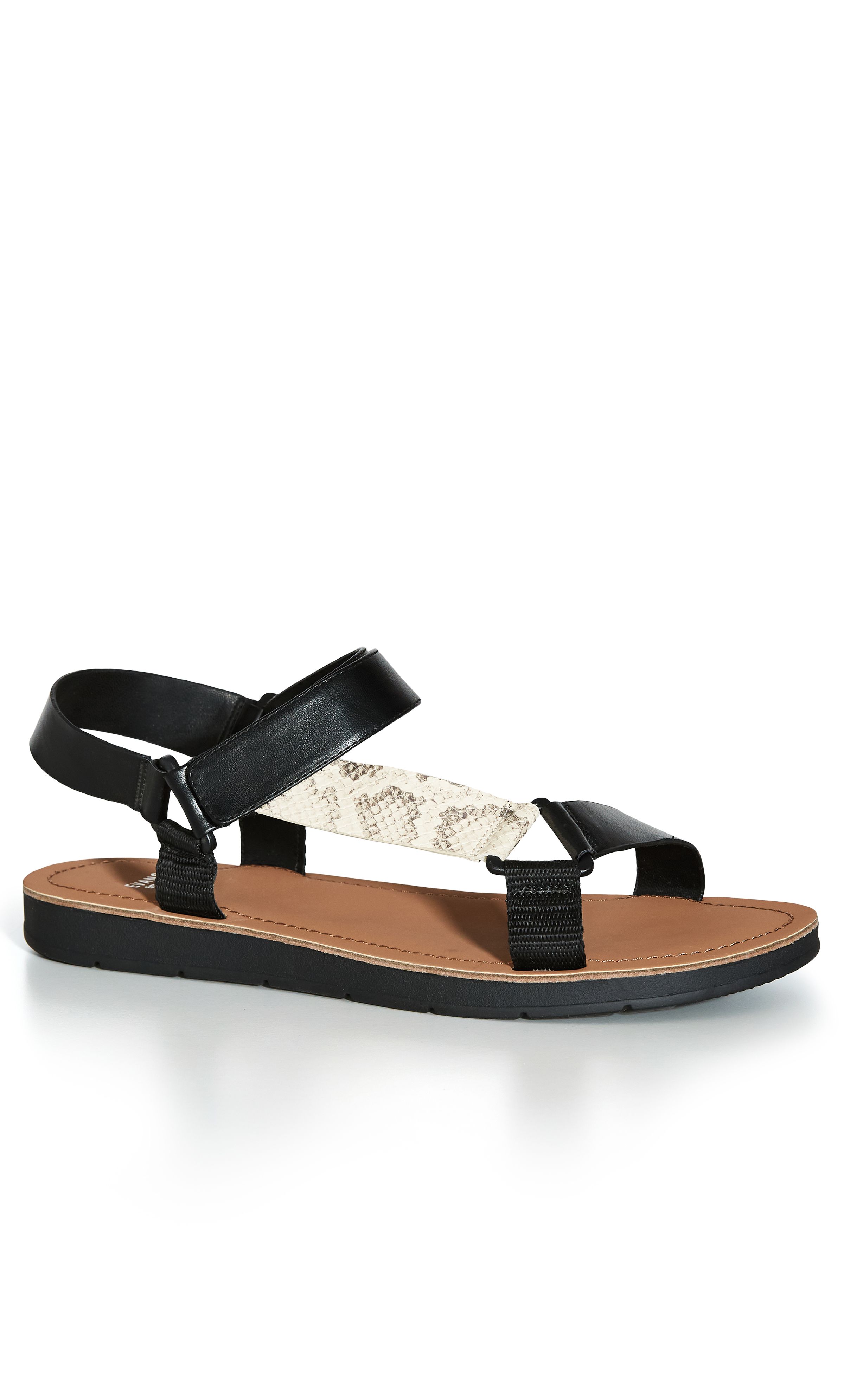 Keep on-trend this summer in the chunky stylings of our Snake Sporty Strap Sandal! Featuring an easy velcro closure and extra wide fit, these shoes are a seamless balance of comfort and style. Key Features Include: - Round open toe - Thick strapping - Velcro closure - Thick cushioned sole Upstyle with a flirty wrap dress and cute underarm bag.