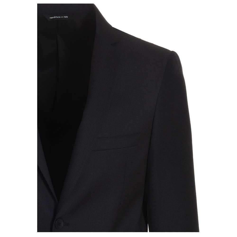 Stretch wool single breast blazer with peak lapels, a welt pocket and a double split at the back.