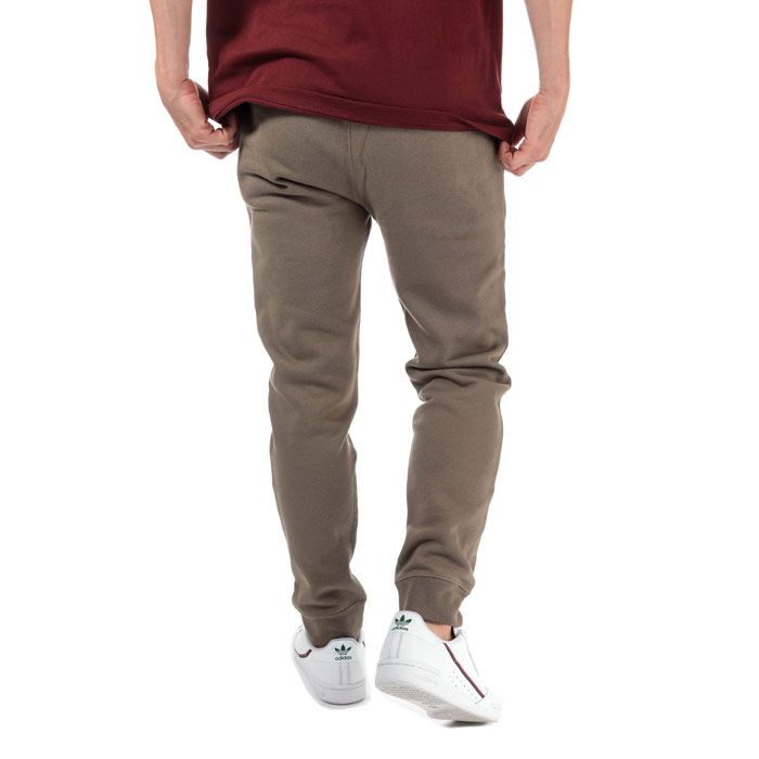 Mens Champion Large Logo Jog Pants in brown.<BR><BR>- Ribbed elasticated waist with drawcord.<BR>- Side seam pockets.<BR>- Cotton terry script logo at left leg.<BR>- Signature C logo embroidered at left hip.<BR>- Ribbed cuffs.<BR>- Regular fit.<BR>- 100% Cotton.  Machine washable.<BR>- Ref: 213515 MS051