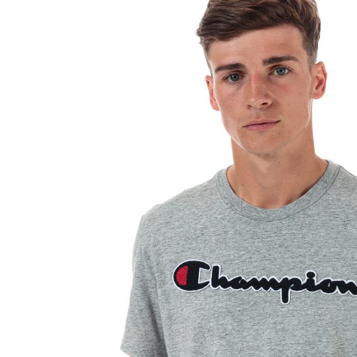 Mens Champion Large Logo T-Shirt in grey marl.<BR><BR>- Ribbed crew neck.<BR>- Short sleeves.<BR>- Cotton terry script logo to chest.<BR>- Signature C logo embroidered at left sleeve.<BR>- Tonal back neck tape.<BR>- Comfort fit.<BR>- 60% Cotton  40% Polyester.  Machine washable.<BR>- Ref: 213521 EM021