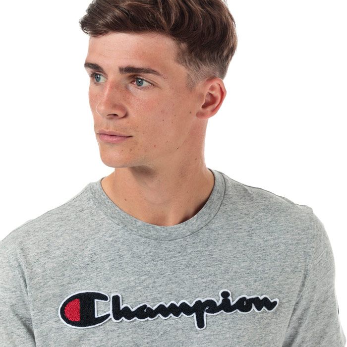 Mens Champion Large Logo T-Shirt in grey marl.<BR><BR>- Ribbed crew neck.<BR>- Short sleeves.<BR>- Cotton terry script logo to chest.<BR>- Signature C logo embroidered at left sleeve.<BR>- Tonal back neck tape.<BR>- Comfort fit.<BR>- 60% Cotton  40% Polyester.  Machine washable.<BR>- Ref: 213521 EM021