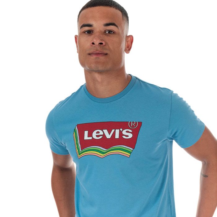 Mens Levi’s Graphic Varsity T-Shirt in Parisian blue.<BR><BR>- Ribbed crew neck.<BR>- Short sleeves. <BR>- Levi's graphic logo printed to front.<BR>- Levi’s logo tab to side.<BR>- Tonal back neck tape.<BR>- Soft and comfortable cotton jersey fabric.<BR>- 100% Cotton.  Machine washable.<BR>- Ref: 22491-0806