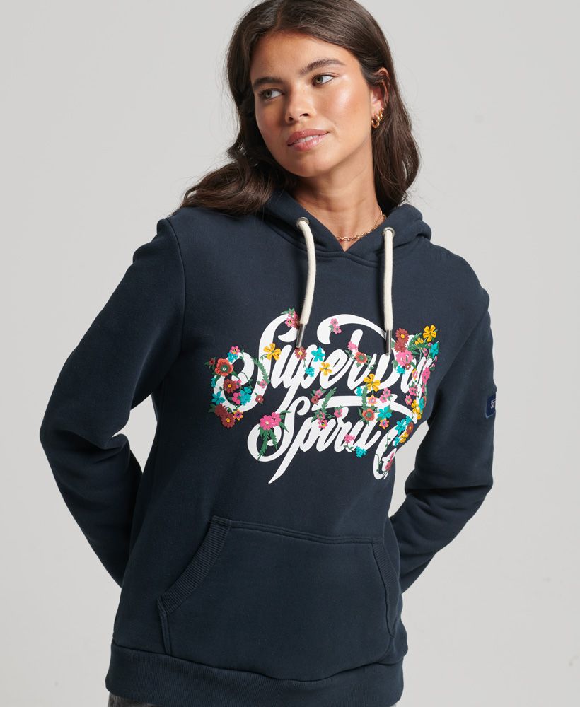 Art is all about creativity and we prize that here at Superdry. We're always being inspired by the big cities when it comes to our graphics, and the Script Style Floral Hoodie will bring some summer into this season.Relaxed fit – the classic Superdry fit. Not too slim, not too loose, just right. Go for your normal sizeDraw cord hoodieLong sleevesRibbed cuffs, hem and pocket trimsPrinted graphicFront pouch pocketBrushed liningSignature Superdry patch