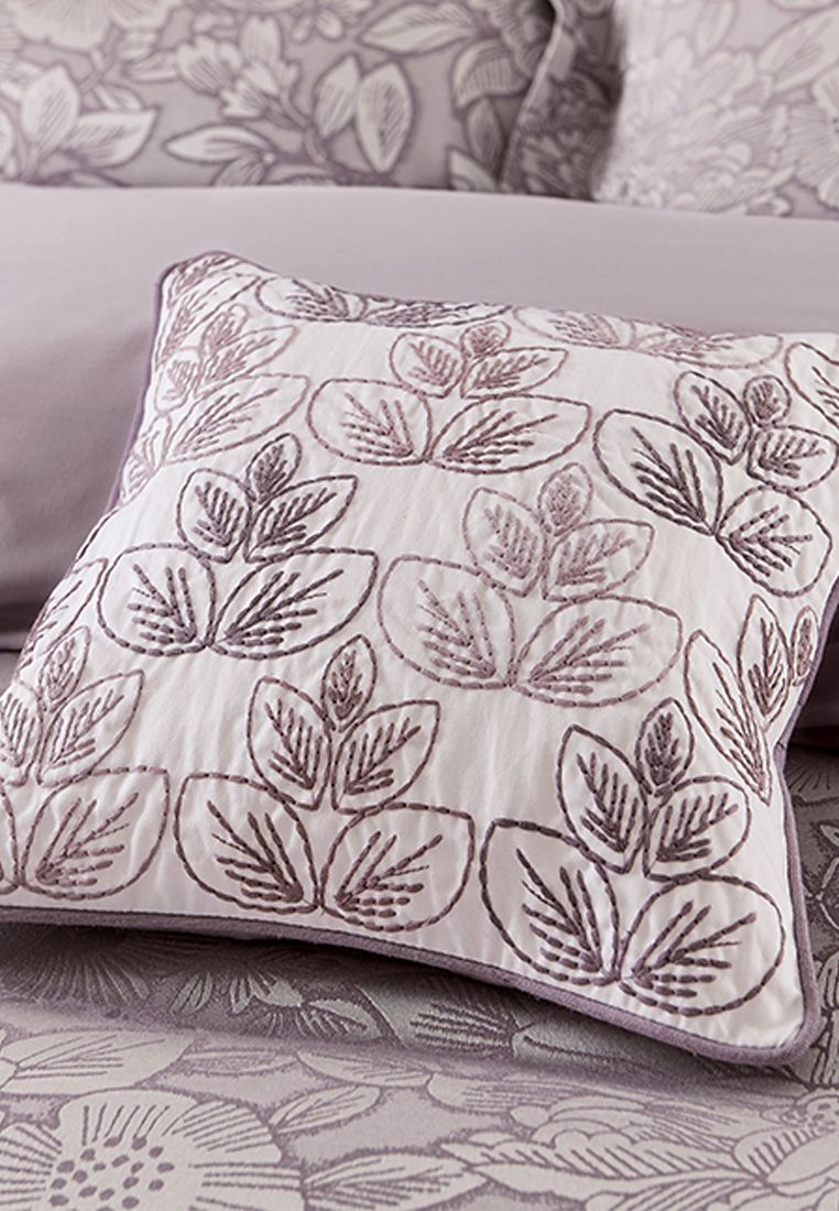A little accent cushion decorated with a stylised leaf pattern adds the finishing touch. Fibre Filled. Made in India.