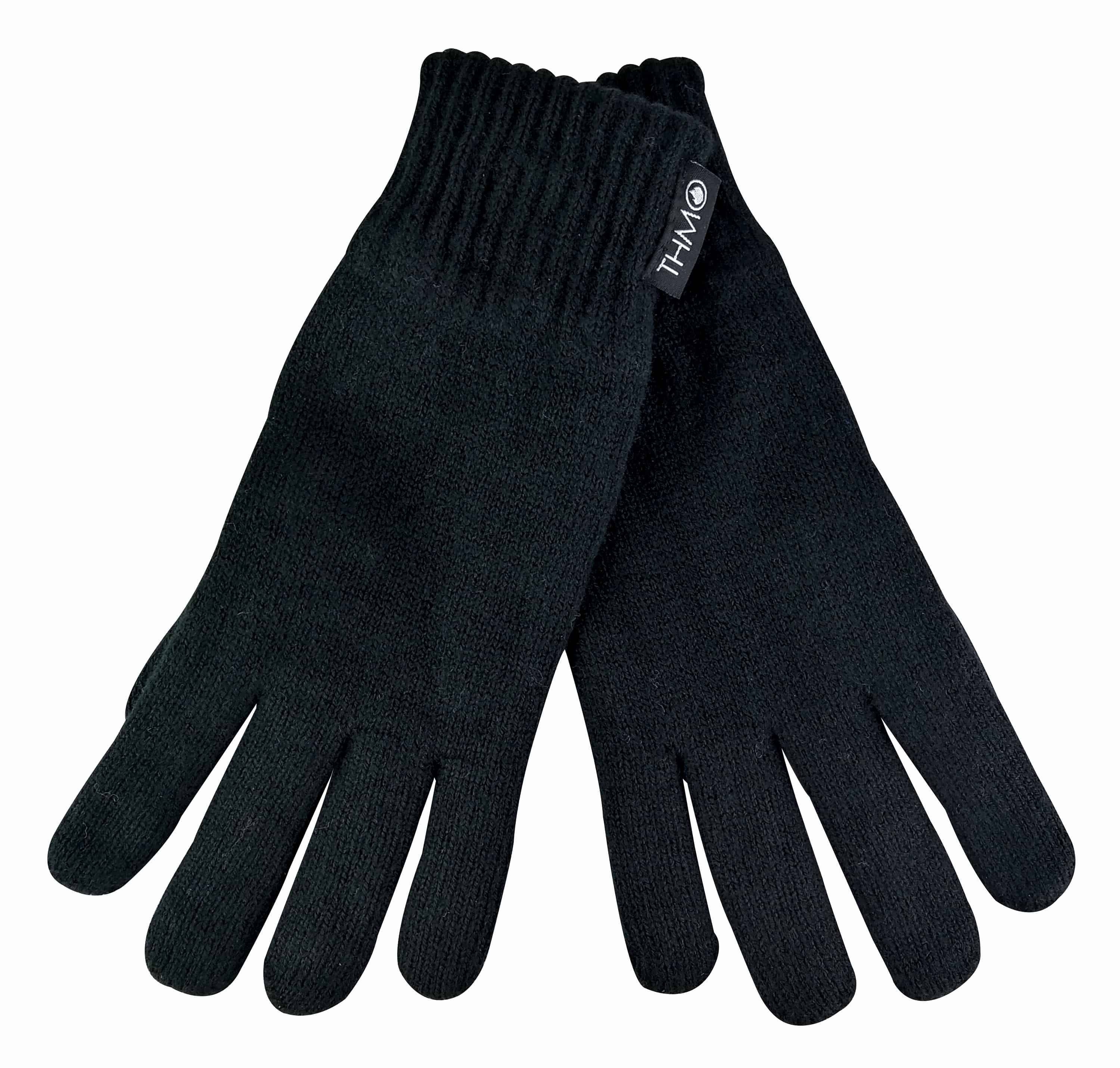 Mens THMO Full Finger Gloves  When blisteringly cold temperatures hit it is usually the end of your limbs that are hit the hardest. This obviously includes your hands. If you are looking for Gloves with expert knitting and effective lining then these mens THMO full finger Gloves with thinsulate lining are the items you need to keep your hands warm and protected.  These Gloves have two layers built into them to facilitate the process of keeping your hands warm. The outer layer is knitted made with 100% acrylic and is there to protect your hands from cold elements. The inner lining is made with 3M Thinsulate lining. Thinsulate is well known for keeping your hands warm and is considered one of the most effective linings. The purpose of the lining is to hold warm air inside the Gloves and to keep the hot air close to your skin. The ribbed cuff on the Gloves is tight enough to stop the warm air escaping but not too tight to be uncomfortable.  The THMO logo badge also hangs from the cuff, separating your glove fashion from the rest. Remember... BE WARM, THINK THMO. These Gloves are available in 2 colours including black and grey and there are 2 sizes to choose between including M/L & L/XL. They are made from 100% acrylic and are made with 2 layers. They are safely machine washable.  Extra Product Details  - THMO - Mens Full Finger Gloves - 100% Acrylic  - 3M Thinsulate Lining - Expert Insulation - Secure Cuff - 2 Sizes M/L & L/XL - 2 Colours Black & Grey - Machine Washable