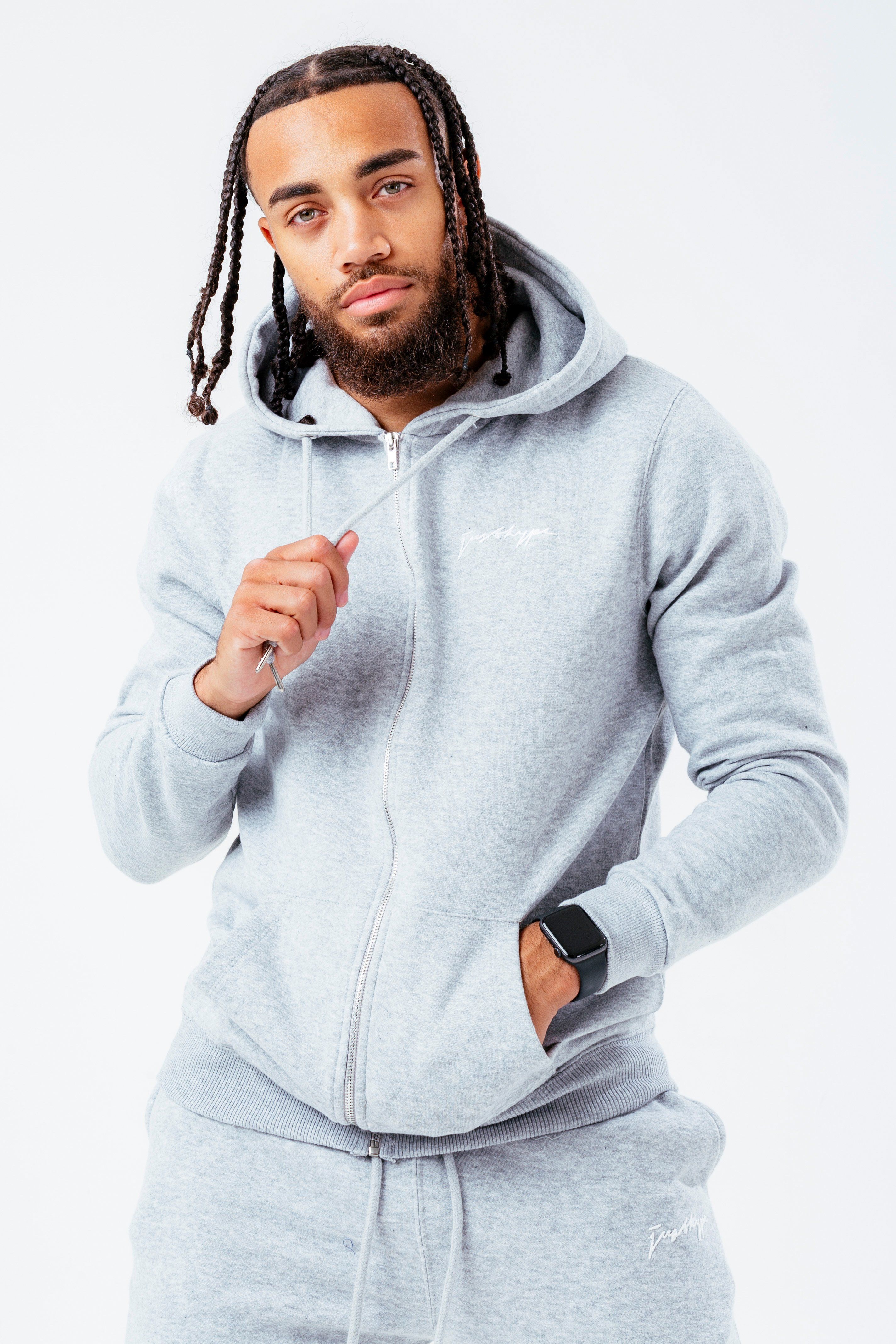 The HYPE. Men's marble tracksuit set is the new go-to everyday essential. Designed in our classic zip jacket shape, with a fixed hood and fitted hem and cuffs. Which is paired with our standard fit, ultimate comfort joggers, featuring drawstring pullers and an elasticated waistband. With a marble inspired all-over print in contrasting grey tones. Finished with the embroidered just hype signature logo on the front in a contrasting white. Machine washable.