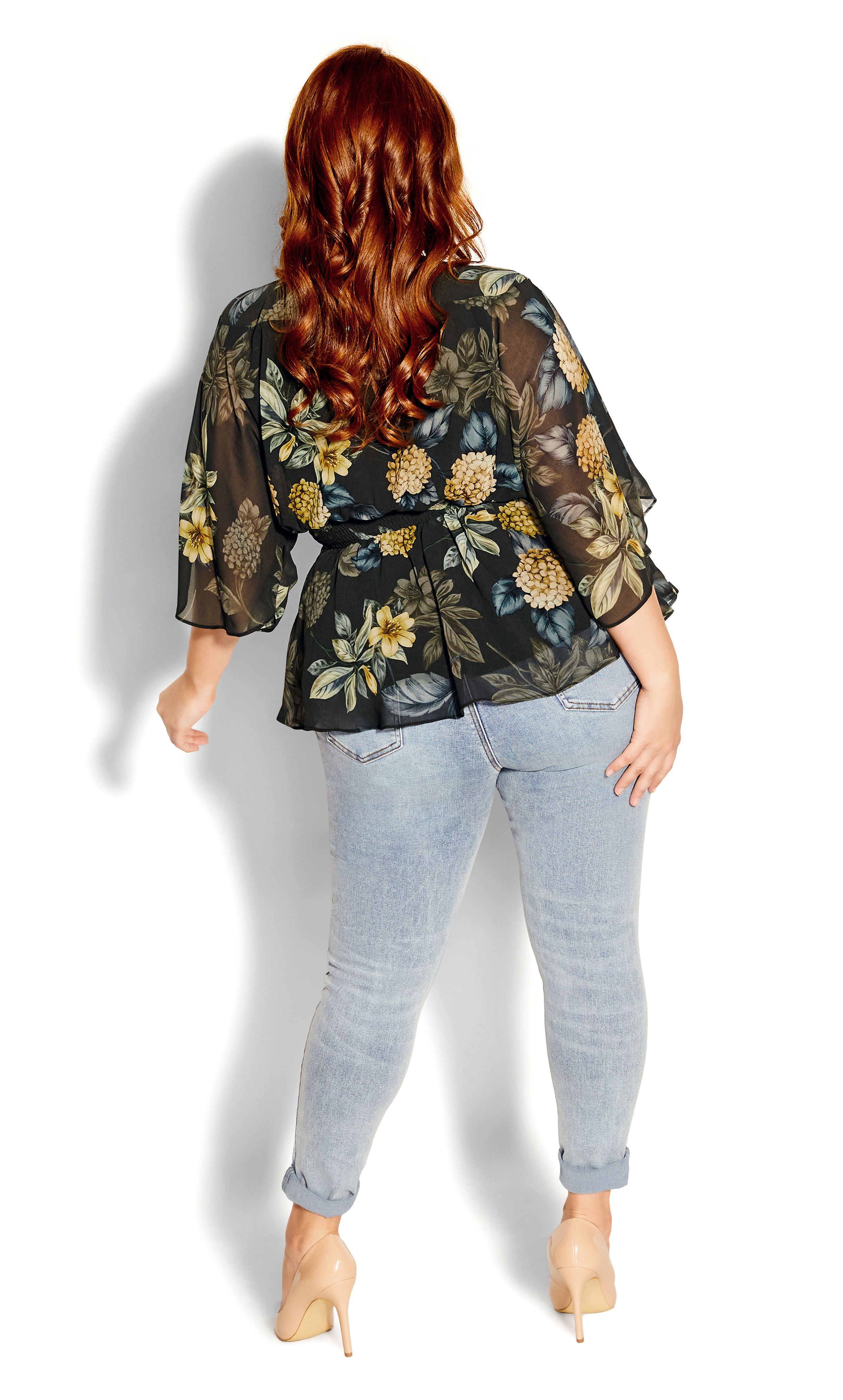 Wrap your curves in lavish florals with the Golden Hydrangea Shirt. With a flattering faux wrap finish and feminine flare sleeves, you'll be rocking this statement top all year round. Key Features Include: - Faux wrap V-neckline - Three-quarter flared sleeves - Elasticated back waist - Fit & flare silhouette - Attached self-tie waist belt - Pull over style - Fully lined - Hip length Style this with a trendy block heel and your favourite dark jeans for a classic day-to-night look.