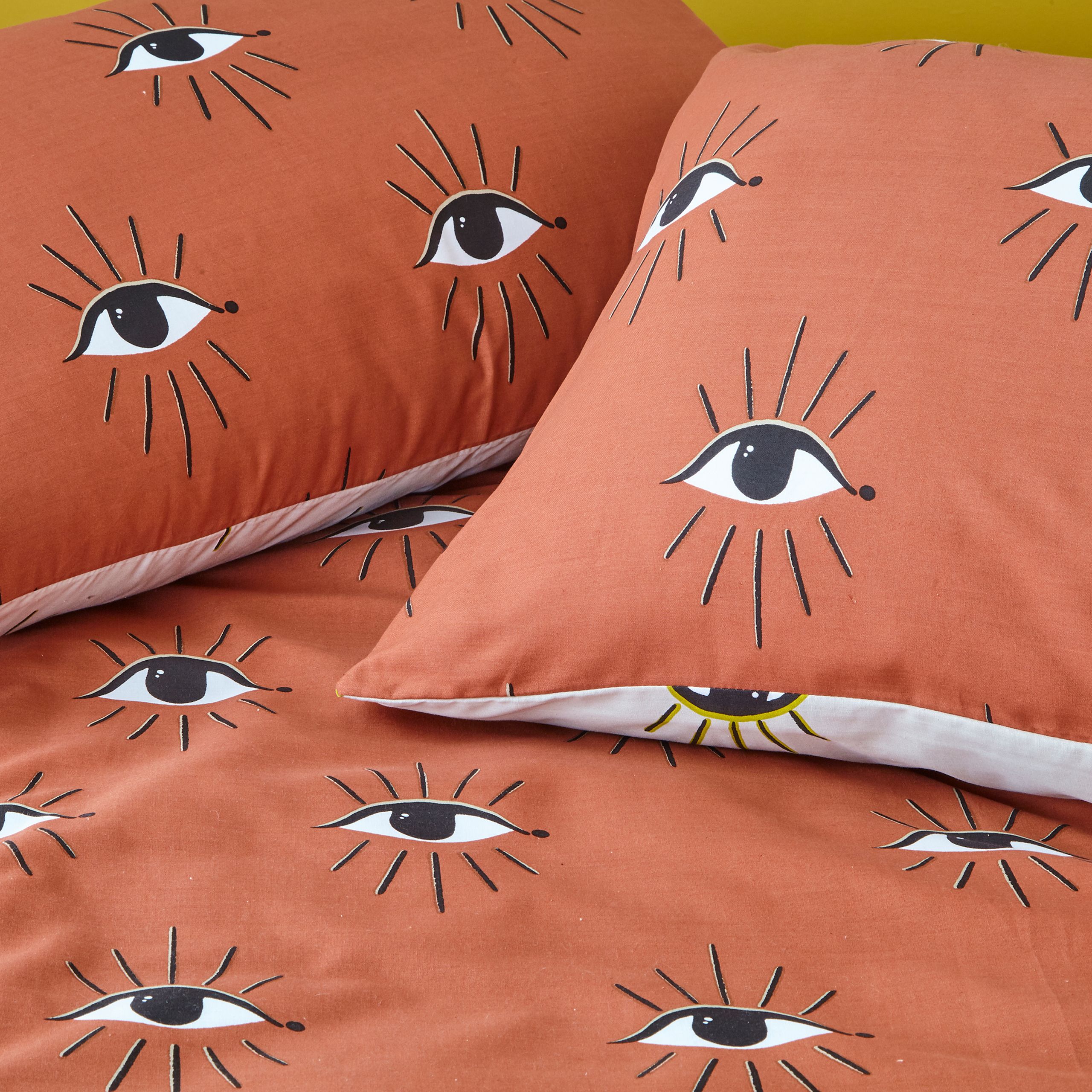 Add instant personality into your bedroom with this bold duvet set, featuring mystical watching eyes design. This has a neutral reversible design so you can switch the look when you need to.