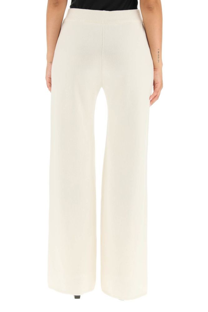 Cashmere and cotton knit trousers by Magda Butrym with a straight and wide leg cut. Elasticated medium waist with ribbed finish. The model is 177 cm tall and wears a size FR 36.