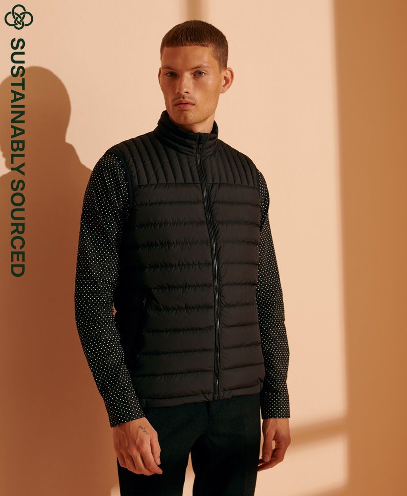 Designed with you in mind, the Ultimate Core Down Gilet, featuring a premium duck down filling to provide you with extra warmth and comfort this season. Who knew being sustainably friendlly could look this good? Perfect for layering over a classic hoodie with jeans to complete the look.Main zip fasteningTwo coated zip fastened pocketsElasticated hem90/10 premium duck down filling giving a low fill power ratingSignature logo badgeSuperdry is certified by the Responsible Down Standard to confirm that our down filled products are sourced to ensure animal welfare.