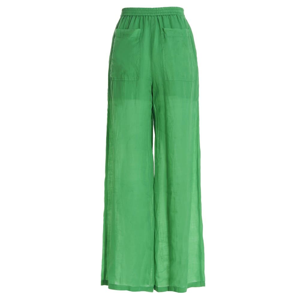 Linen pants with a loose leg and an elastic waistband.