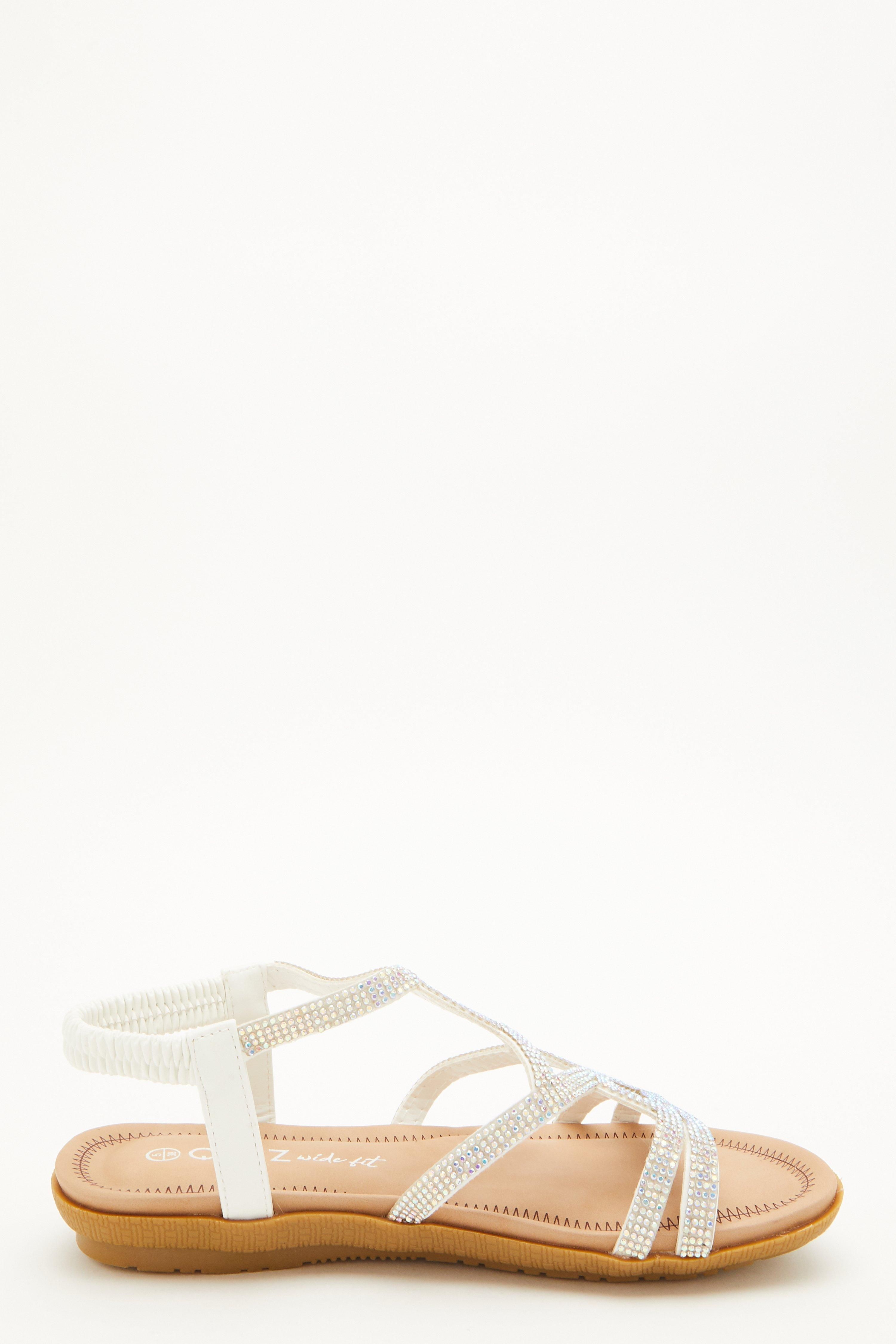 - Wide fit   - Flat sandals  - Diamante detail   - Twist strap desgin   - Elasticated strap  - Padded insole for added comfort