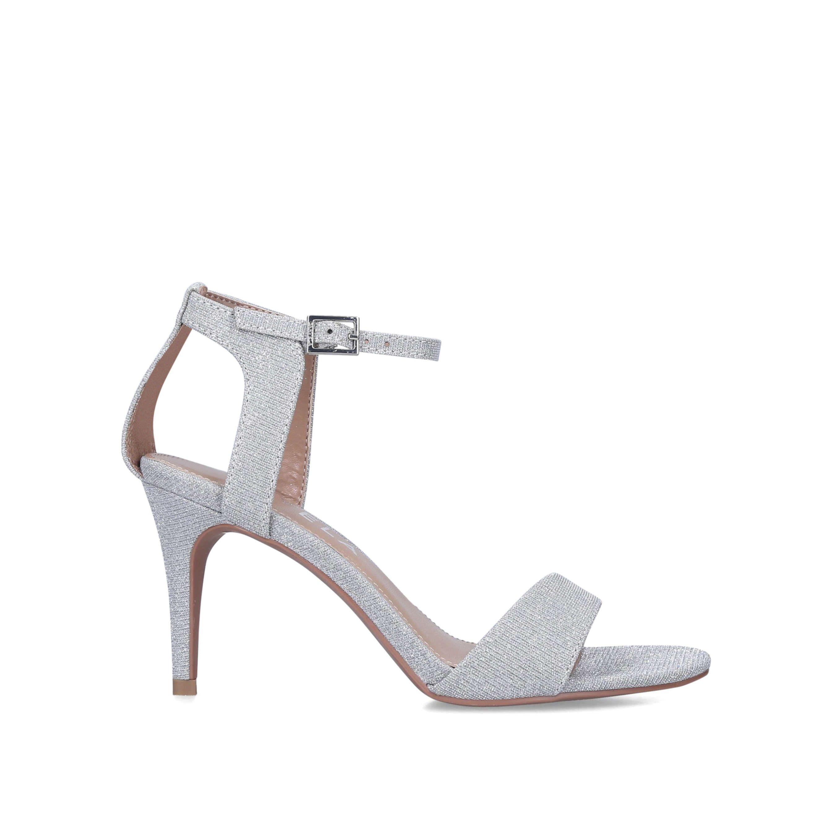 Woven with silver glitter, the Kolluding strappy heels feature a rounded toe and thin straps with buckle adjustability around the cut out ankle. The thin heel sits at a comfortable mid height 85mm.