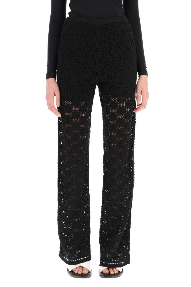 Jil Sander high-waisted trousers in macramé cotton knit with a floral pattern, cut to a slim fit with straight leg. Side zip closure, slash pockets. Lined with shorts. The model is 177 cm tall and wears a size DE 34.