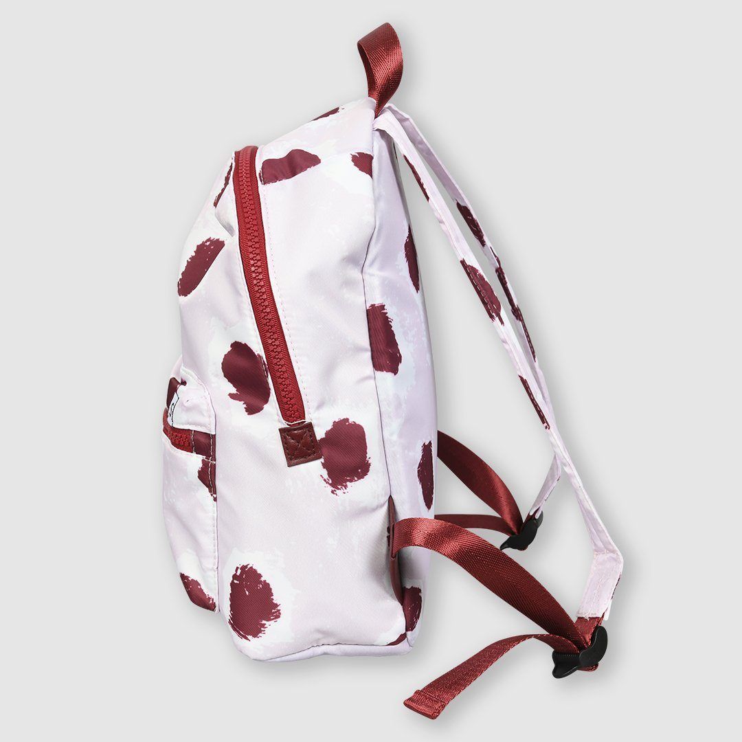 Kids backpack in our signature painted dot print in pink and burgundy featuring a zipped front pocket, adjustable padded straps and top carry grab handle. 