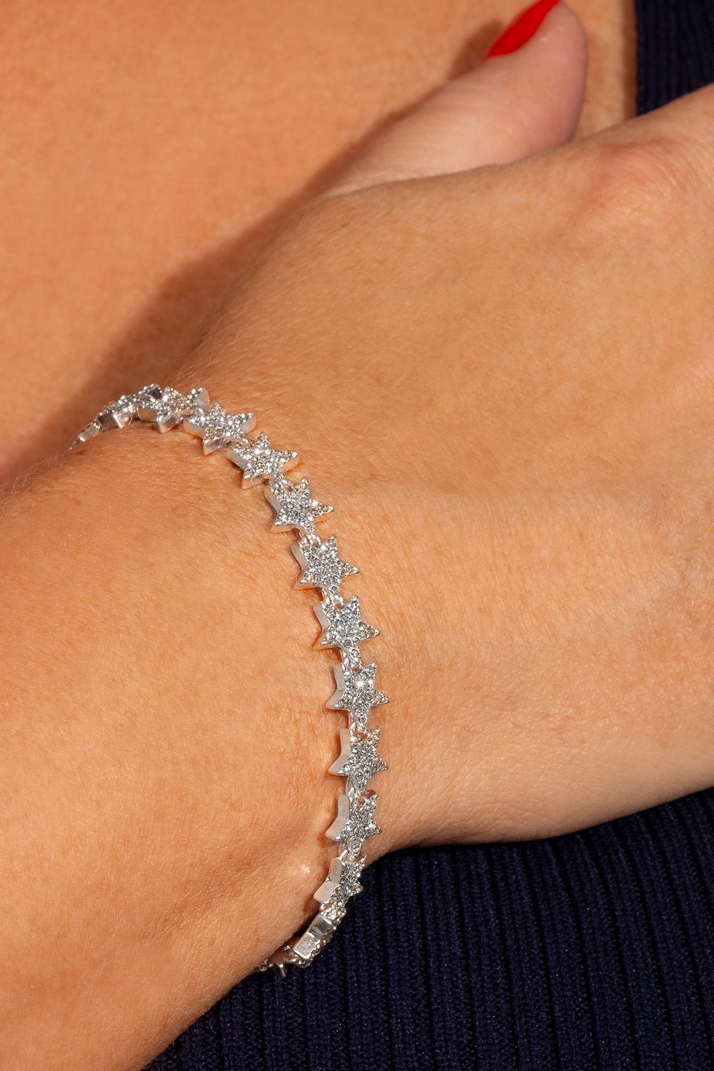 The Kate Thorton Sparkling Stars bracelet looks stunning with a day time chunky knit look on its own, and you can really bring the glamour by teaming it up with the matching necklace and earrings too. The tennis style bracelet is silver plated and adorned with pave clear stones across every star, and it comes with an extender too. A classic look with a cool twist, fans of sparkle and celestial jewellery will love this piece!