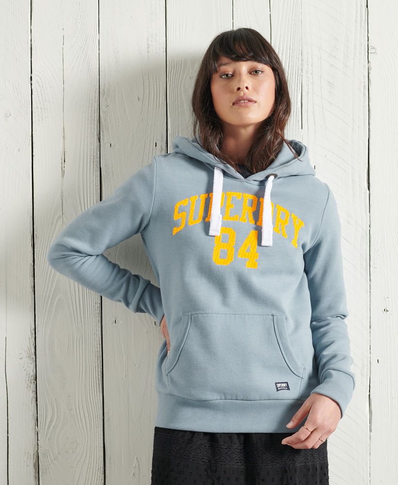 Update your hoodie collection this season with the Limited Edition Graphic Standard hoodie, featuring a Superdry logo across the chest and a fleece lining for that extra bit of warmth.Relaxed fit – the classic Superdry fit. Not too slim, not too loose, just right. Go for your normal sizeDrawstring hoodLong sleevesFront pouch pocketRibbed cuffs and hemTextured Superdry logoSignature logo patchThe desert sky blue Graphic Standard hoodie features a twist on the classic embroidered Superdry logo across the chest.