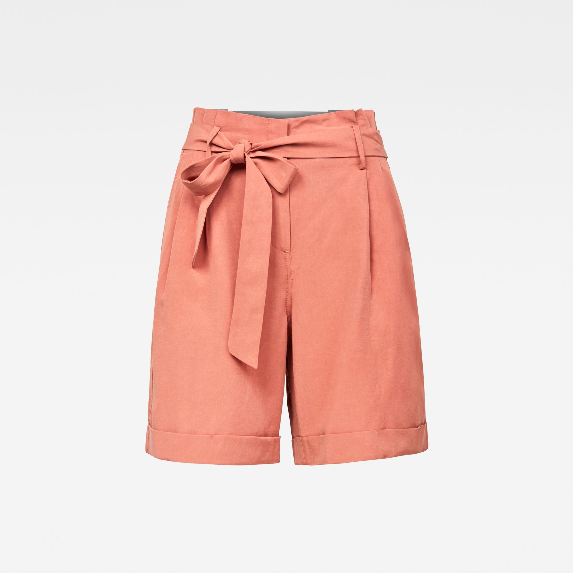 Fitted waistband. High waist. Pleated front- stitch down. Sideseam pockets and slim welt back pockets. Zip fly. G-Star RAW woven label at the upper hip. Zip & button closure. High waist. 85% Lyocell (Tencelâ„¢), 15% Linen. The pleats at the front of this bermuda length shorts are reinforced with a strong stitch down. A high waisted short with sidepocket and slim welt back pockets. The backside of the Pleated High short is designed with additional seams at the upper hip to create a slim fit upper back. Woven