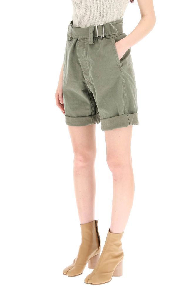 Maison Margiela shorts in pure cotton herringbone twill with very high waist and cuffed hem. Oversized belt loops, self-fabric belt with sliding buckle, button fly with hidden hook-and-eye, side pockets. Signature four-stitches moniker on the back. The model is 177 cm tall and wears a size IT 38.