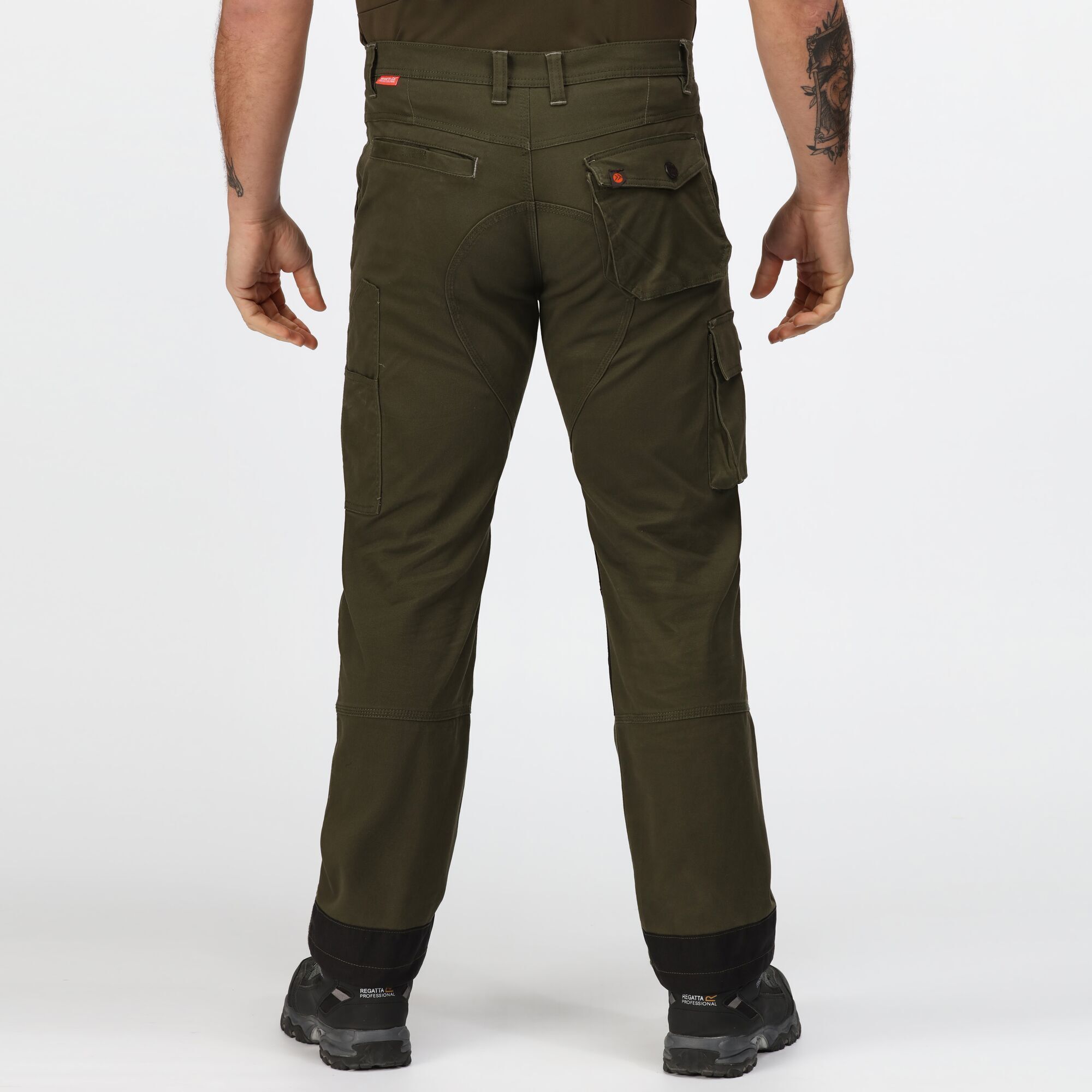 Mens work trousers with Cotton twill with stretch. Fabric weight 270gsm. Cordura bottom loading knee pockets. Belt loops. Reinforced seams with triple stitching. Reinforced crotch seam. 2 front pockets. 2 back pockets. Concealed zipped pocket. 1 cargo leg pocket. Side leg Ruler pocket. Reinforced hem overlays. Compatible with Tactical Threads. 2% Elastane, 98% Cotton. Regular: 32in.