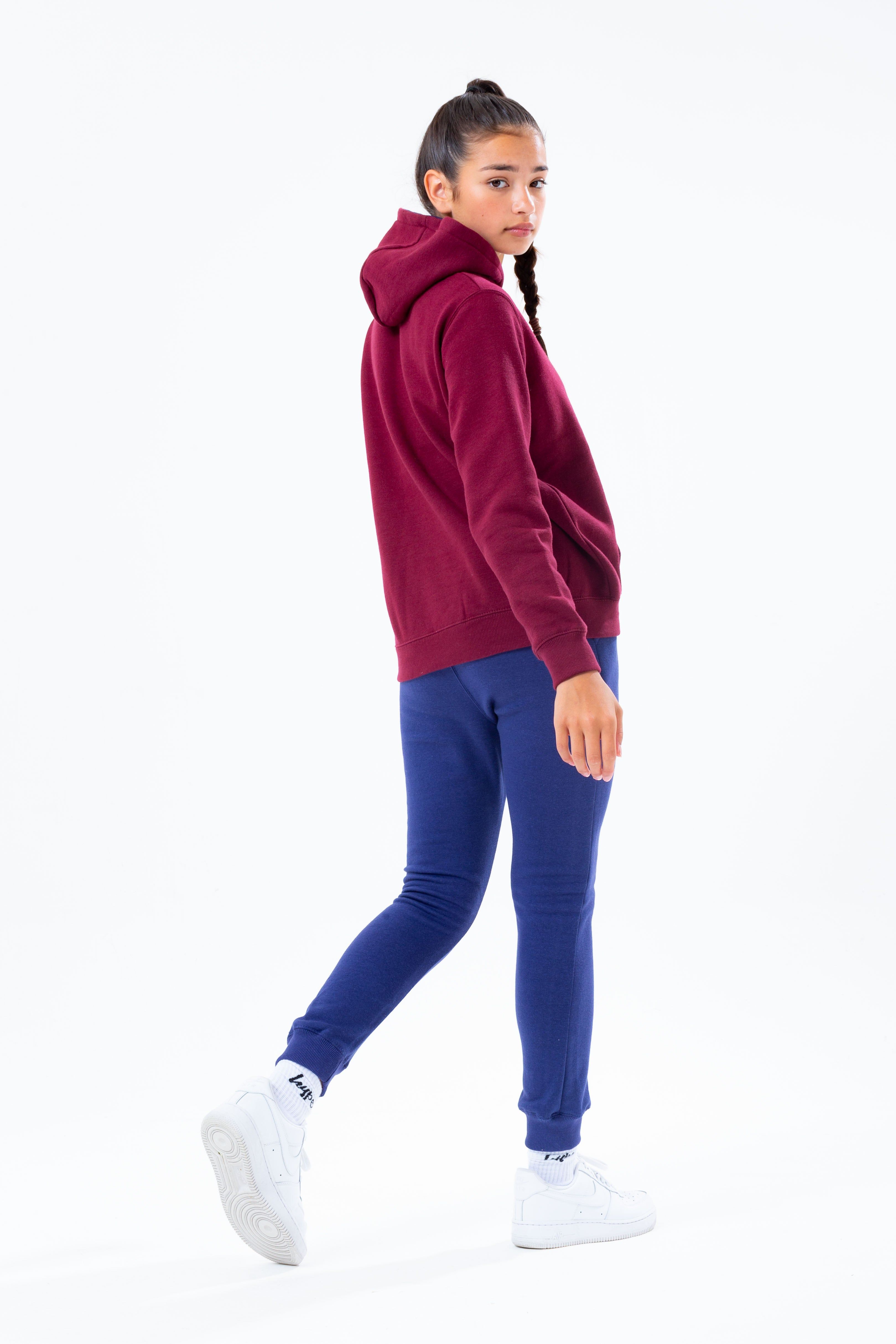 The HYPE. burgundy hoodie navy jogger kids set is perfect for off-duty casual days. Designed in a burgundy and navy fabric base with the ultimate soft-touch sweat fabric for supreme comfort. The kids hoodie highlights a fixed hood, fitted hem and cuffs, finished with the iconic HYPE. script logo  across the front. The joggers boast an elasticated waistband and fitted cuffs with the HYPE. mini script logo. Wear stand alone or as a set with a pair of box fresh kicks to complete the look. Machine wash at 30 degrees.