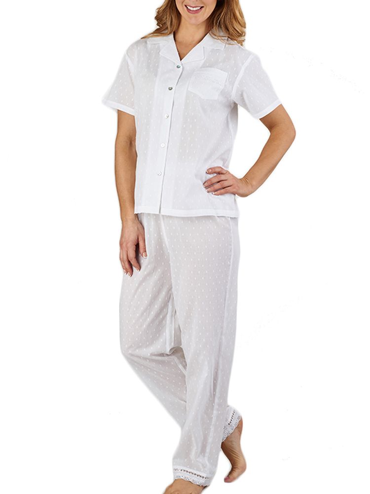 A luxuriously lightweight pyjama made in 100% cotton with dobby dot detail throughout. Designed with a 5 button through tailored style top with short sleeves. This comes with our matching long trouser, with an elasticated waistband. It has a broderie trim to front pocket and to the trouser hems. Size Guide: S/M (10/12), M/L (12/14), XL/2XL (16/18), 3XL/4XL (20/22).