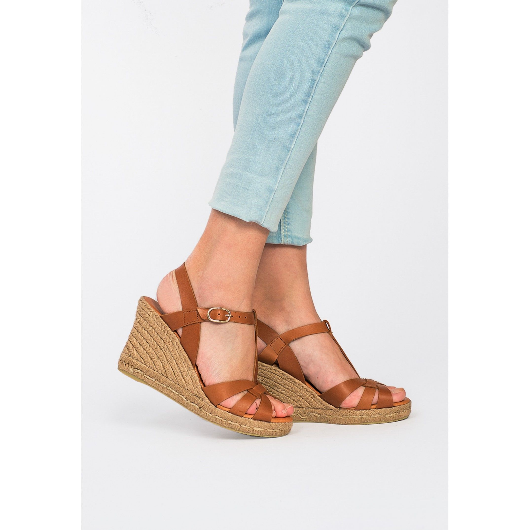 Ankle strap wedge sandals for women. By Eva Lopez Shoes. Upper made of cowhide leather. Metal buckle closure. Inner lining and insole: pig lining. Padded shoe sole: 0.3 cm. Sole material: synthetic. Heel height: 8 cm. Platform: 2 cm Designed and manufactured in Spain.