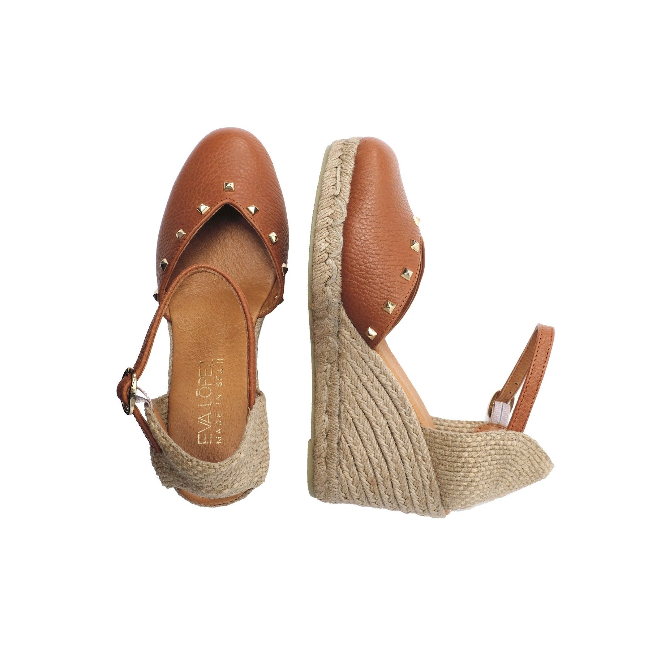 Ankle strap wedge sandals for women. By Eva Lopez Shoes. Upper made of cowhide leather. Metal buckle closure. Inner lining and insole: pig lining. Padded shoe sole: 0.3 cm. Sole material: synthetic. Heel height: 8 cm. Platform: 2 cm Designed and manufactured in Spain.