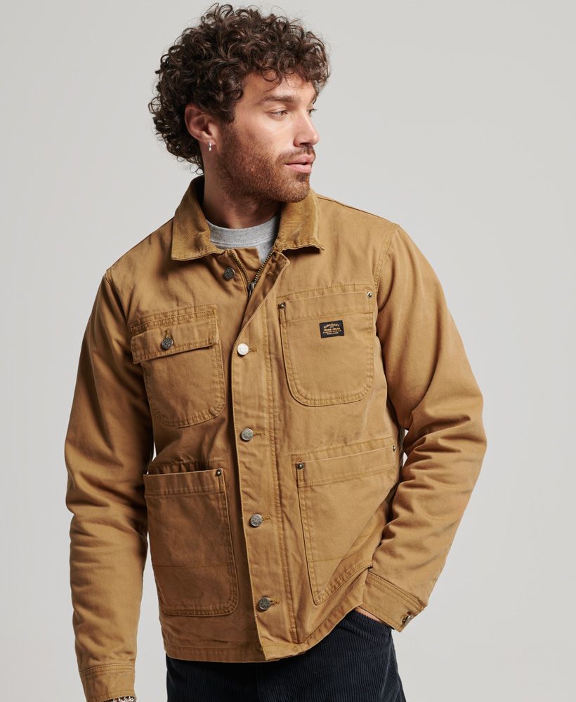 The classic western aesthetic of hardy fashion is a staple of our vintage range. Featuring a luxuriously soft borg lining, the Workwear Ranch jacket's combination of a cosy interior and a durable exterior makes for a reliable and versatile layering option. This style channels the heritage of the ranch workers who inspired it, bringing a contemporary interpretation of a traditional design to your cold-weather wardrobe.Relaxed fit – the classic Superdry fit. Not too slim, not too loose, just right. Go for your normal sizeZip and button fasteningButton fastened cuffsFour front pocketsSignature Superdry patch on chest pocketLoose borg-lined bodyLined sleevesInternal popper pocket