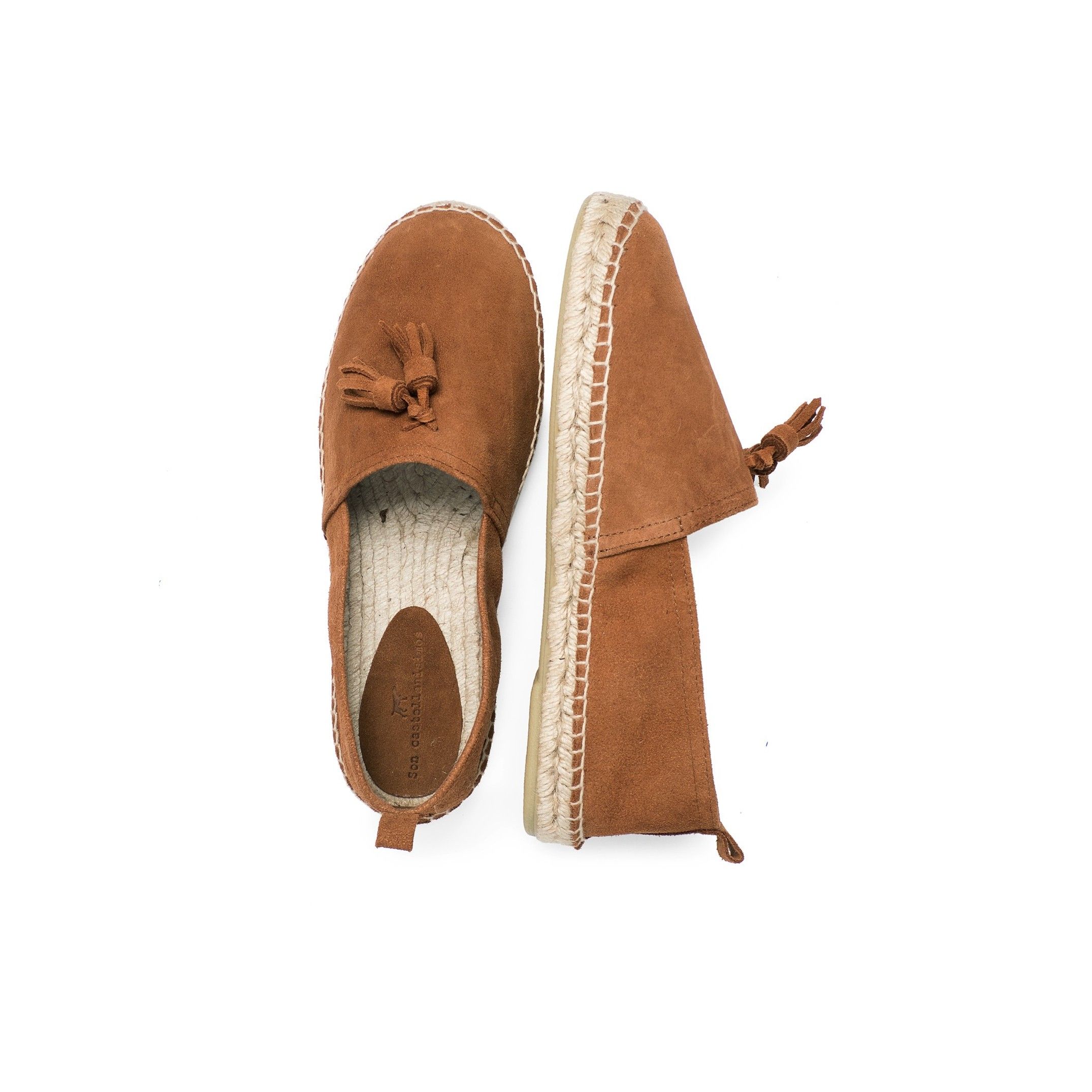 Split leather flat espadrilles with tassels, by Castellanisimos. Upper made of cowhide leather. Inner lining and insole: 25% cowhide leather and 75% of textile. Sole material: synthetic and non slip. Heel height: 2 cm. Designed and made in Spain.