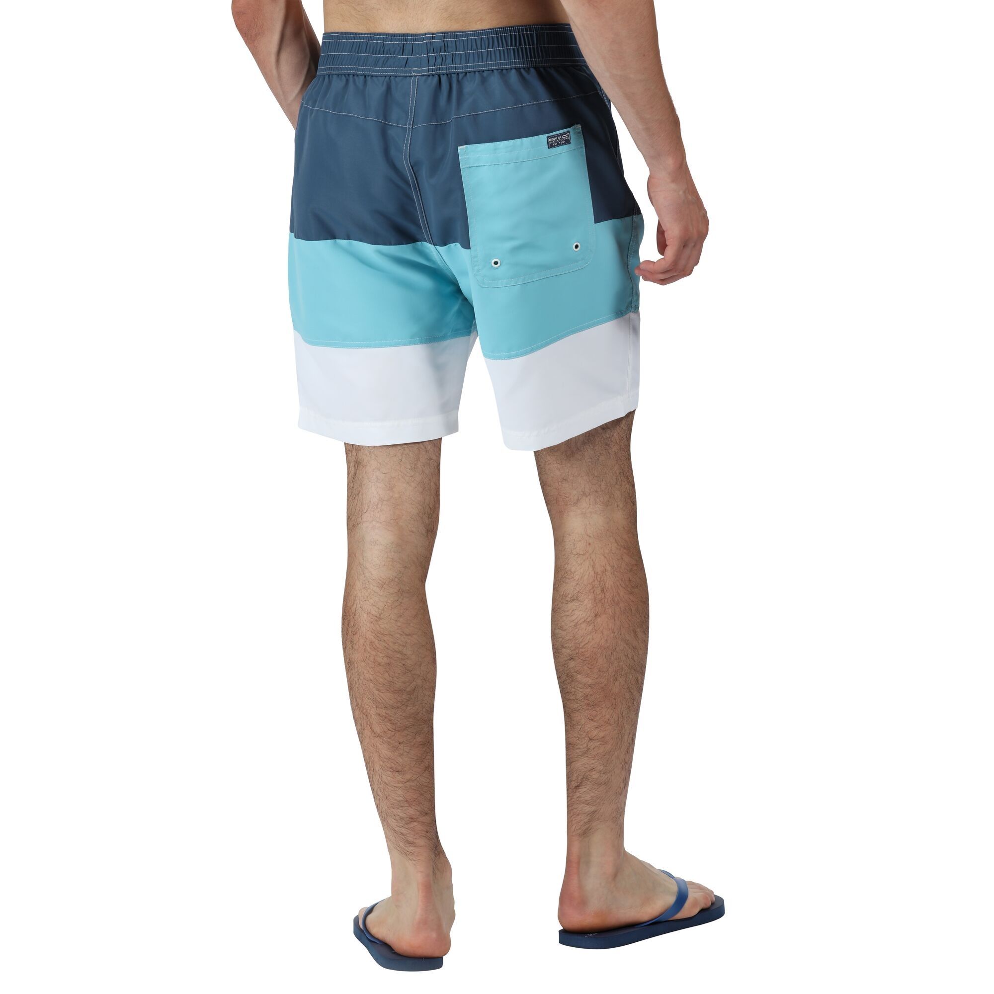 Material: 100% polyester taslan fabric. Quick drying fabric. Adjustable drawcord waist. 2 side pockets. 1 back pocket. Mesh brief liner with security pocket.