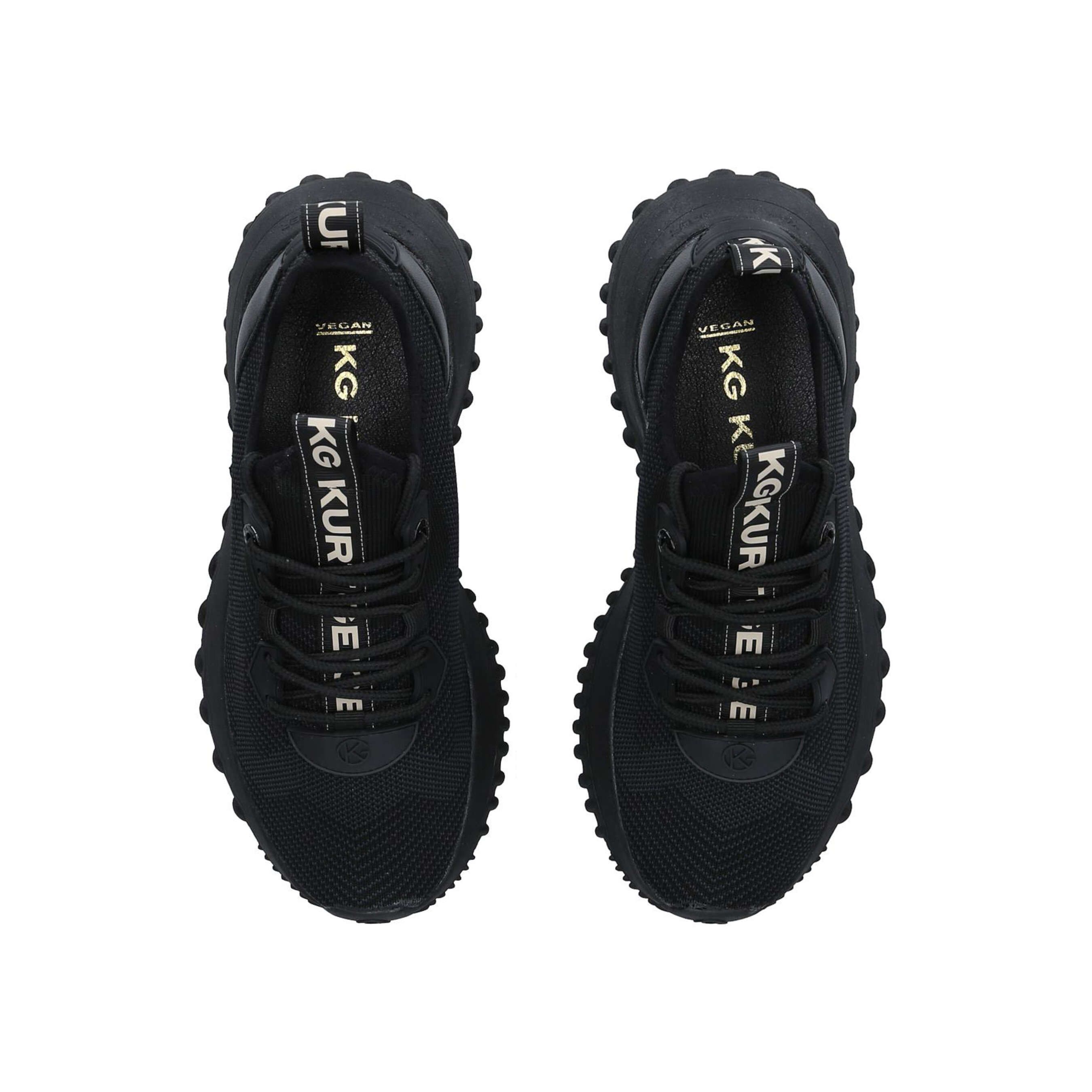 The Lowell Knit sneaker features a black fabric upper with lace up front. The heel and tongue feature the KG Kurt Geiger logo printed on ribbed textile with a print stitch detailing. The sole features a tread detail.