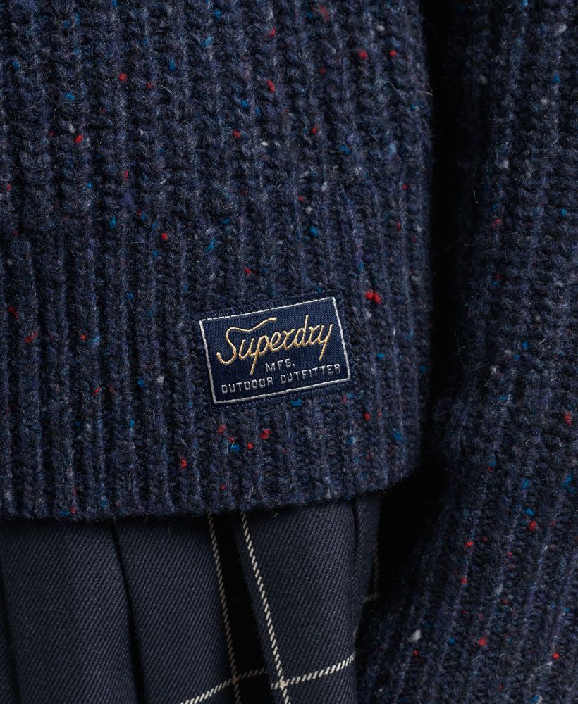 Those colder months are on their way so stock up on your winter cosies while you can. Wool-rich and drawing on the heritage of an outdoors lifestyle, this Tweed Ribbed Crew Neck Jumper will be the one you turn to for your unique and relaxed style when the weather takes a turn.Relaxed fit – the classic Superdry fit. Not too slim, not too loose, just right. Go for your normal sizeRibbed designCrew necklineSignature patch logoLambswool rich fabric