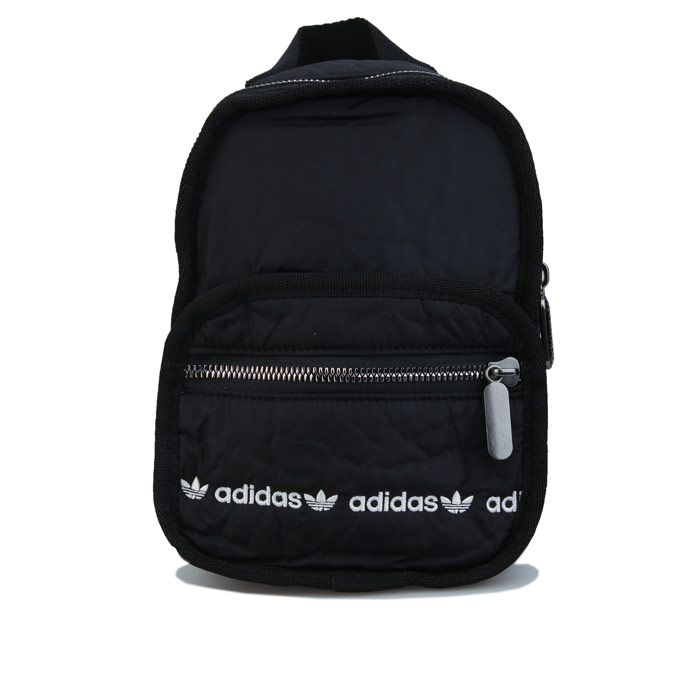 adidas Originals Mini Backpack in black.- Padded adjustable shoulder straps.- Inner slip-in pocket.- Front zip pocket.- adidas Originals logo.- Lined.- Volume: 3.5 L.- Dimensions: 15 cm x 22 cm x 9 cm.- Main material: Outer: 100% Nylon.  Innen: 100% Polyester. Lining: 100% Polyester.- Ref.: GE4780Measurements are intended for guidance only!