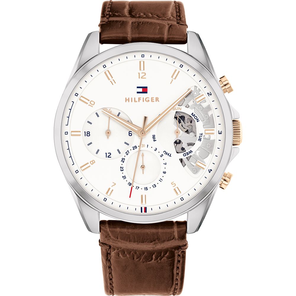 This Tommy Hilfiger Baker Multi Dial Watch for Men is the perfect timepiece to wear or to gift. It's Silver 44 mm Round case combined with the comfortable Brown Leather watch band will ensure you enjoy this stunning timepiece without any compromise. Operated by a high quality Quartz movement and water resistant to 5 bars, your watch will keep ticking. Get all the comfort with this fashionable croco-embossed leather band, perfect for every occasion  -The watch has a calendar function: Day-Date High quality 21 cm length and 21 mm width Brown Leather strap with a Buckle Case diameter: 44 mm,case thickness: 10 mm, case colour: Silver and dial colour: White