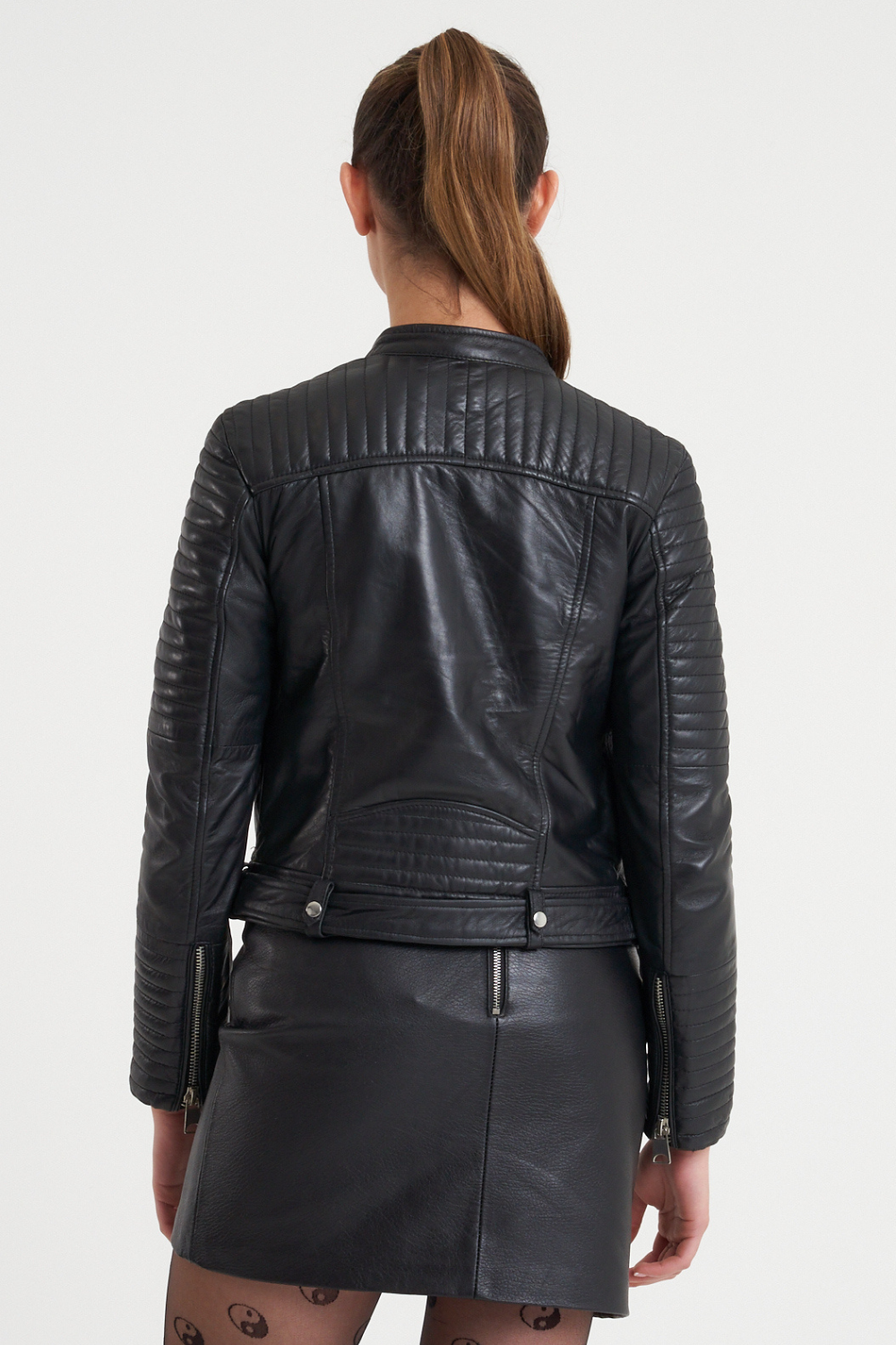 This leather jacket features all the hallmarks of an iconic racer jacket; tab neck collar, adjustable waistbelt and asymmetric zipline. This gorgeous piece also features unique ribbed shoulder detailing that is wadded for extra dimension.