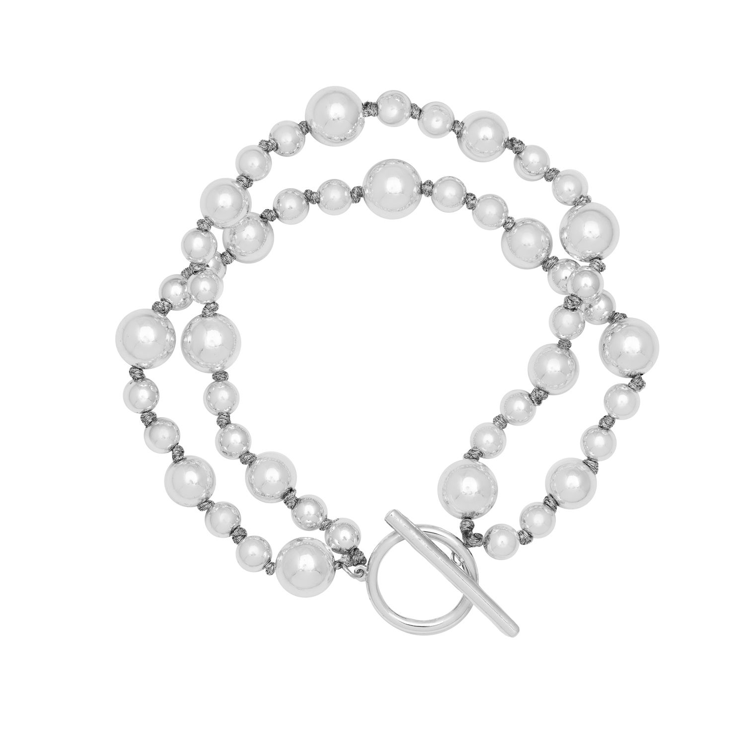 Our Silver plated Artisan Ball bracelet is simple and glamorous! An elegant silver ball bracelet comprising of two layers of shiny balls that will adds a touch of glamour to your look. Pair with the matching necklace and earrings for a complete set. Measuring 19.5cm in length with a modern hoop and bar fastening.