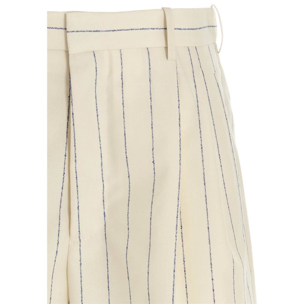 Wool shorts with stripe print, zip and hook closure, center crease, pockets, belt loops and frayed hem.