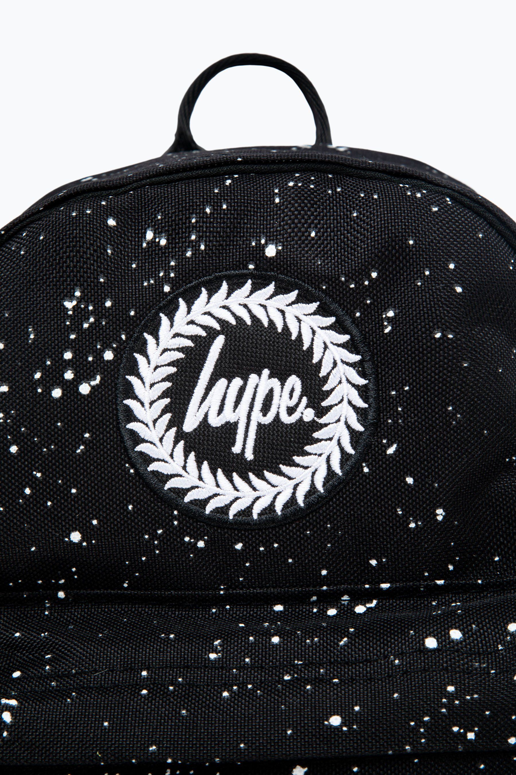 Introducing the HYPE. Black Speckle Mini Backpack, if you're reading this, then you want to know more. Our standard unisex mini backpack shape and style features our signature speckle fade all-over print in a monochrome colour palette. This backpack is the ultimate essential mini bag to transport your everyday essentials, this bag is smaller than our standard backpacks. With embossed adjustable straps with the perfect amount of padding. Finished with the iconic HYPE. crest logo embroidered on the front. Wipe clean only.