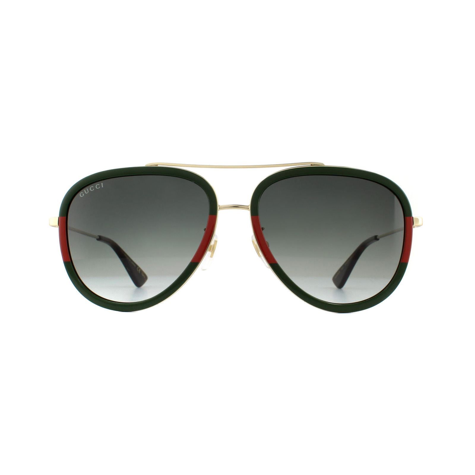 Gucci Sunglasses GG0062S 003 Gold Green Red Green Gradient are a super contemporary version of the classic aviator. The frame front and temple tips are crafted from acetate, and the temples, bridge and brow bar are made from metal, creating a cool contrast. Adjustable nose pads ensure the GG0062s have a personalised fit. Subtle branding can be found on the temples where the GG logo has been incorporated into the temple design.