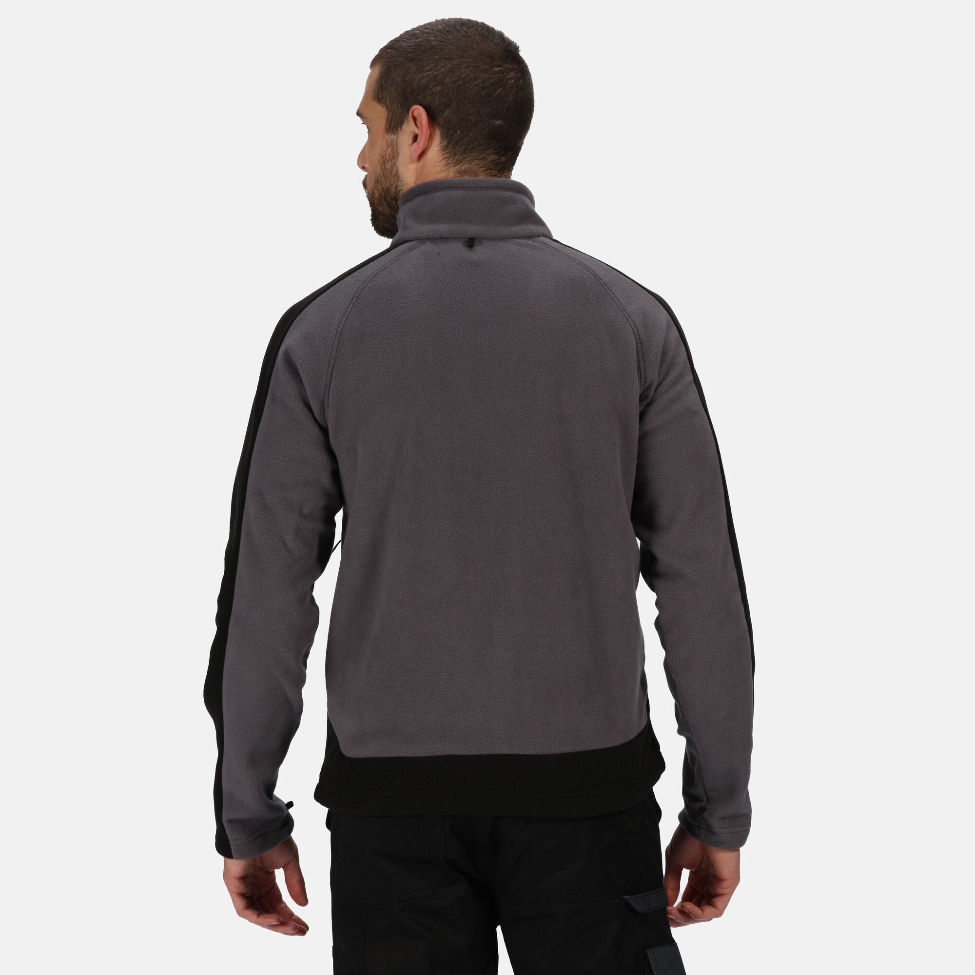 100% Polyester. Anti-pill fleece. Adjustable shockcord hem. Inner zip & chin guard. 1 zipped chest pocket, 2 zipped lower pockets. Interactive attachment loops at cuffs.