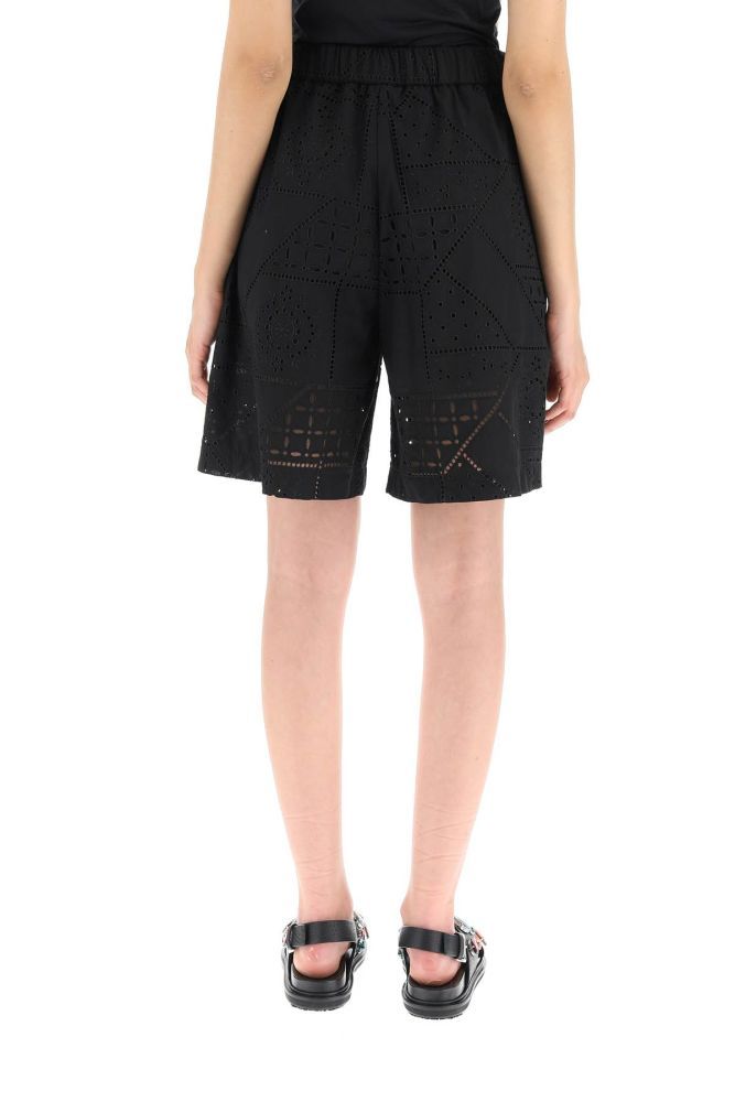 Cotton blend sangallo shorts by MSGM featuring elasticated waist, concealed zip fastening with hook and slash pockets. Lined. Loose fit. The model is 177 cm tall and wears a size IT 38. 