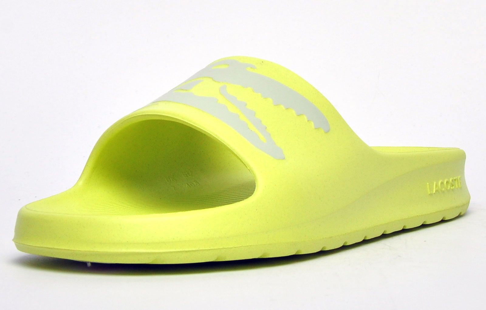 Step into eye catching summer style with these mens Croco Slides from Lacoste. In a bang on trend colourway, these designer sandals are delivered in a smooth synthetic upper with Croco detailing across the forefoot foot strap. The one piece upper delivers a super comfy footbed which moulds to your feet delivering the perfect fit and feel while the grippy outsole will keep you sure and safe around the pool or in the shower. These designer slides are finished with eye catching Lacoste branding throughout just in case you want a sign of approval that youre wearing cool classic style this summer season 
 - One piece synthetic upper
 - Comfort moulded footbed
 - Grippy outsole
 - Slip on wear
 - Iconic Lacoste branding throughout
 Please Note: These Lacoste trainers are sold as B grades which means there may be some very slight cosmetic issues on the shoe and they come in a polybag. We have checked every pair of these shoes and in our opinion at these heavily reduced prices all are very saleable. All shoes are guaranteed against fair wear and tear and offer a substantial saving against the normal high street price. The overall function or performance of the shoe will not be affected by cosmetic issues. B Grades are original authentic products released by the brand manufacturer with their approval at greatly reduced prices. If you are unhappy with your purchase we will be more than happy to take the shoes back from you and issue a full refund.