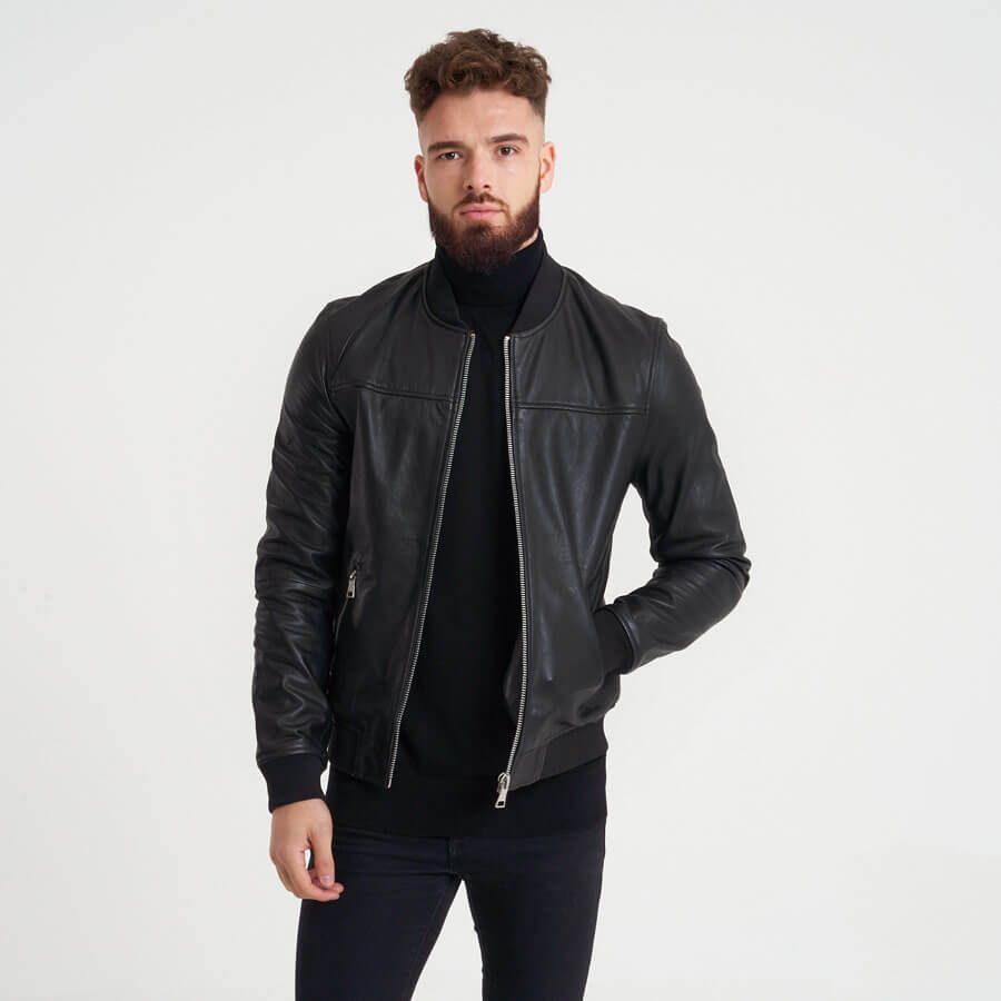This real leather bomber jacket from BARNEYS ORIGINALS features elasticated cuffs and waistline. The leather features a subtle textured surface that ages gracefully with wear.