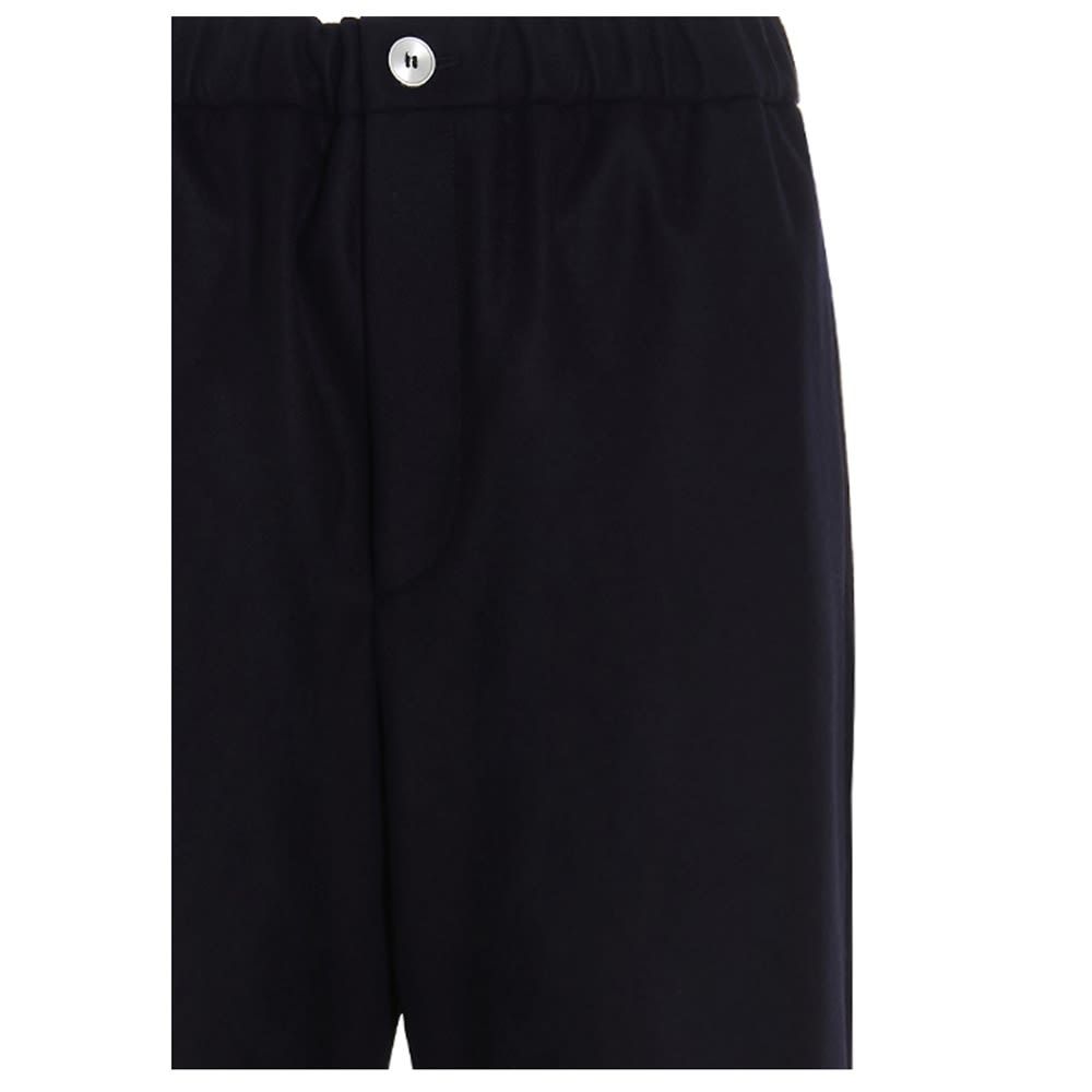 'Jil Sander+' flannel trousers with an elastic waistband, a button closure, and a relaxed fit.