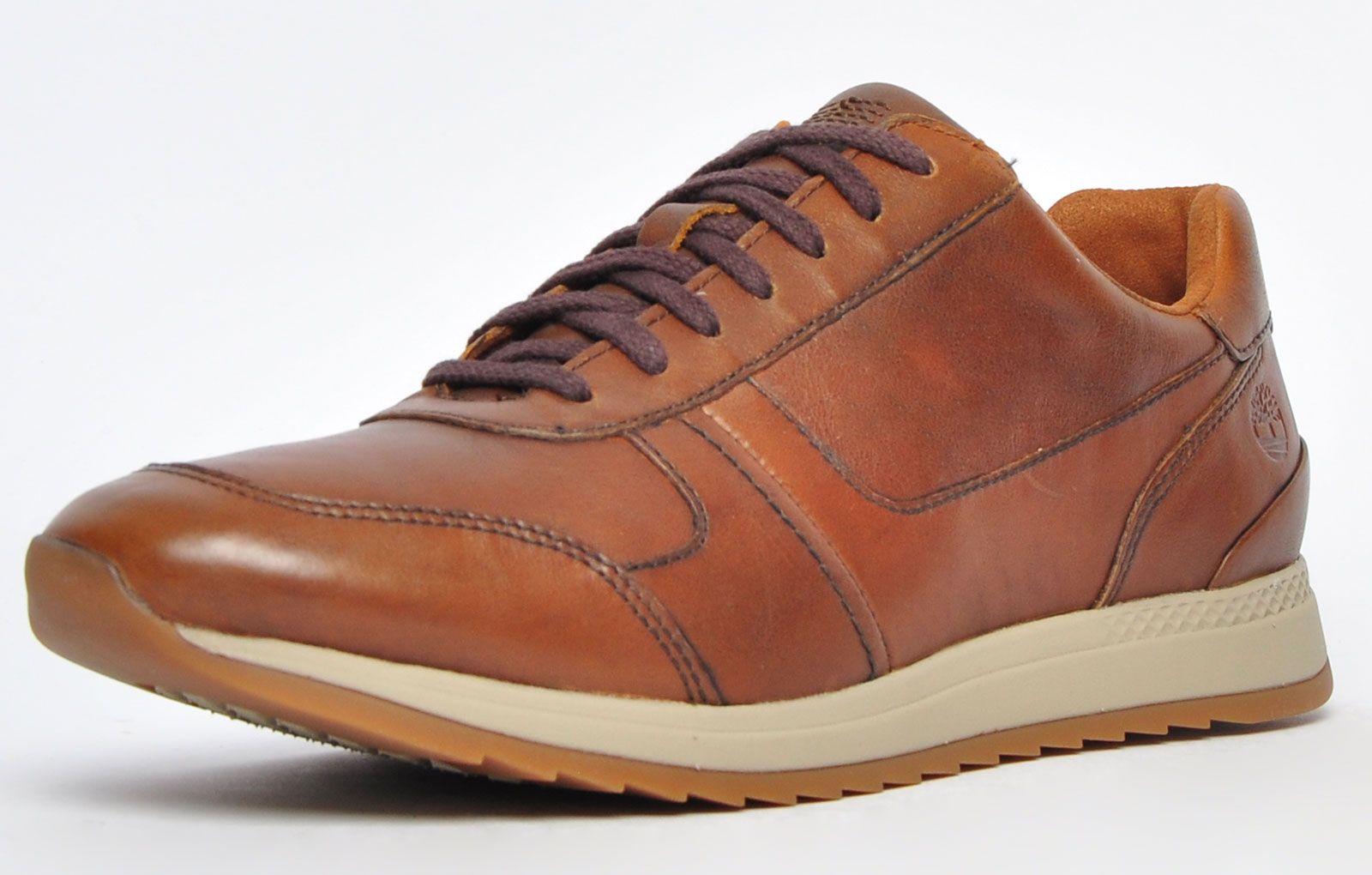 Boasting a smart brown colourway, the Timberland Madaket offers a premium take on the classic hybrid trainer. Constructed with a low-cut silhouette for increased mobility, a premium leather upper, and panelling for added visual appeal, the Madaket delivers a stylish look that can seamlessly transition from day to night and from the workplace to play
 Featuring a cushioned footbed with AeroCore energy system, the Madaket ensures your feet are looked after from your first step out until you return home. Additional toe panelling provides added durability, whilst the rubber outsole ensures increased traction on a variety of surfaces, finished with stylish stitching and a Timberland brand stamp of recognition to the side and tongue
 - Premium leather upper
 - Padded tongue and heel cuff
 - Lace fastening system
 - AeroCore energy system midsole
 - Durable rubber outsole
 - Timberland branding