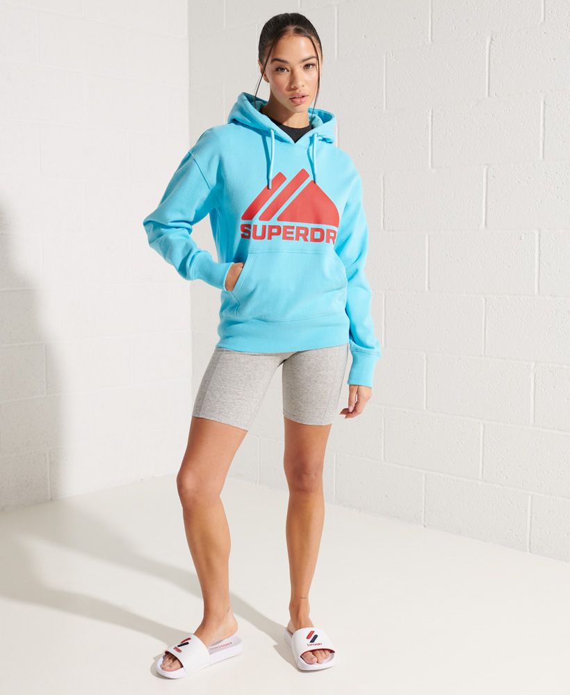 Get the ultimate sporty vibe with our Mountain Sport Mono Hoodie, featuring ribbed panels, and a mountain inspired textured graphic.Relaxed fit – the classic Superdry fit. Not too slim, not too loose, just right. Go for your normal sizeDrawstring hoodSoft liningRibbed cuffs and hemRibbed panelsFront pouch pocketTextured graphicEmbroidered logoSignature logo patch