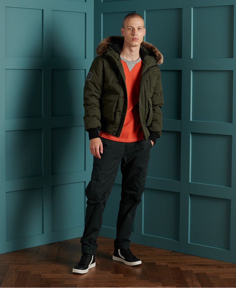 Iconic in style and inspired by the classic bomber jacket, the Everest Quilted Bomber Jacket, featuring a quilted recycled polyester padding designed to keep you warm and cosy on those chilly nights this season. Also featured are four external pockets and one internal breast pocket, ideal for storing your belongings when on your travels. Layer this bomber jacket over any outfit to complete the look.Bungee cord adjuster hoodDetachable faux fur trimMain zip and popper fasteningFive pocket designRibbed cuffs and hemPaddingSignature logo badgeThe padding in this jacket is 100% Recycled Polyester – each jacket contains up to 10 recycled bottles, this avoids these bottles being sent to landfill or polluting our oceans.